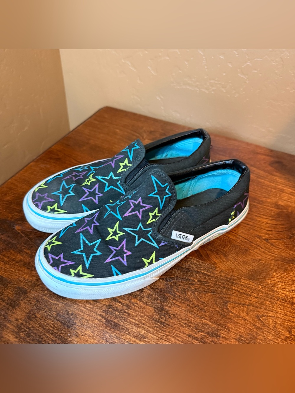 Vans Kids Slip-On Sneakers — Black with Blue, Purple & Yellow Star Pattern
